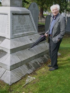 Seamus Heaney pointing out Gerard Manley Hopkins’ name on the communal Jesuit grave at Glasnevin Cemetery, 2009, photo taken by Henri Cole